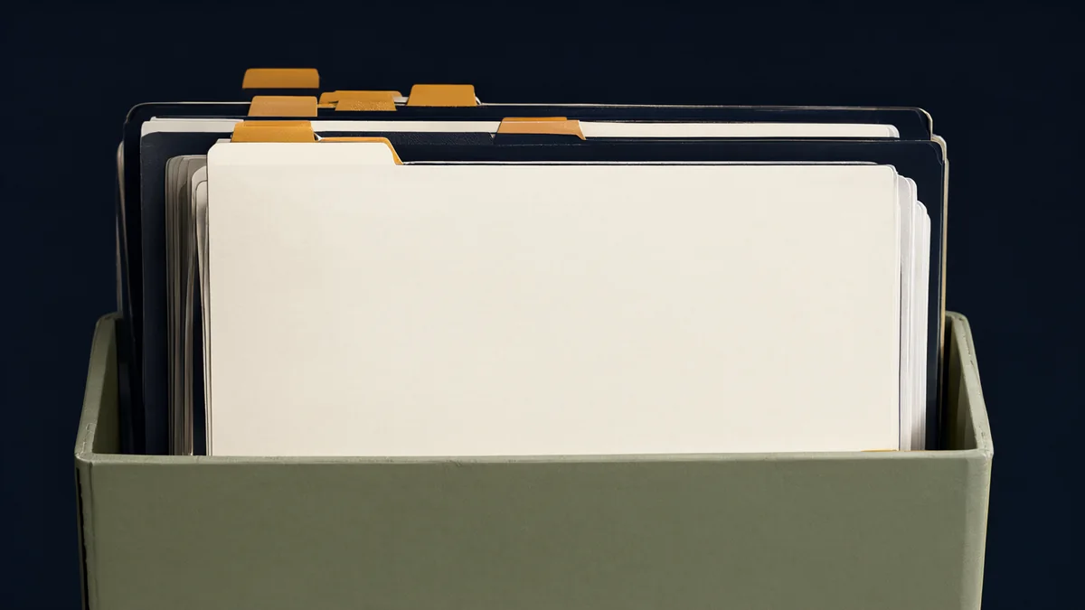 Distinct blank folders with colored tabs arranged in an accordion file.